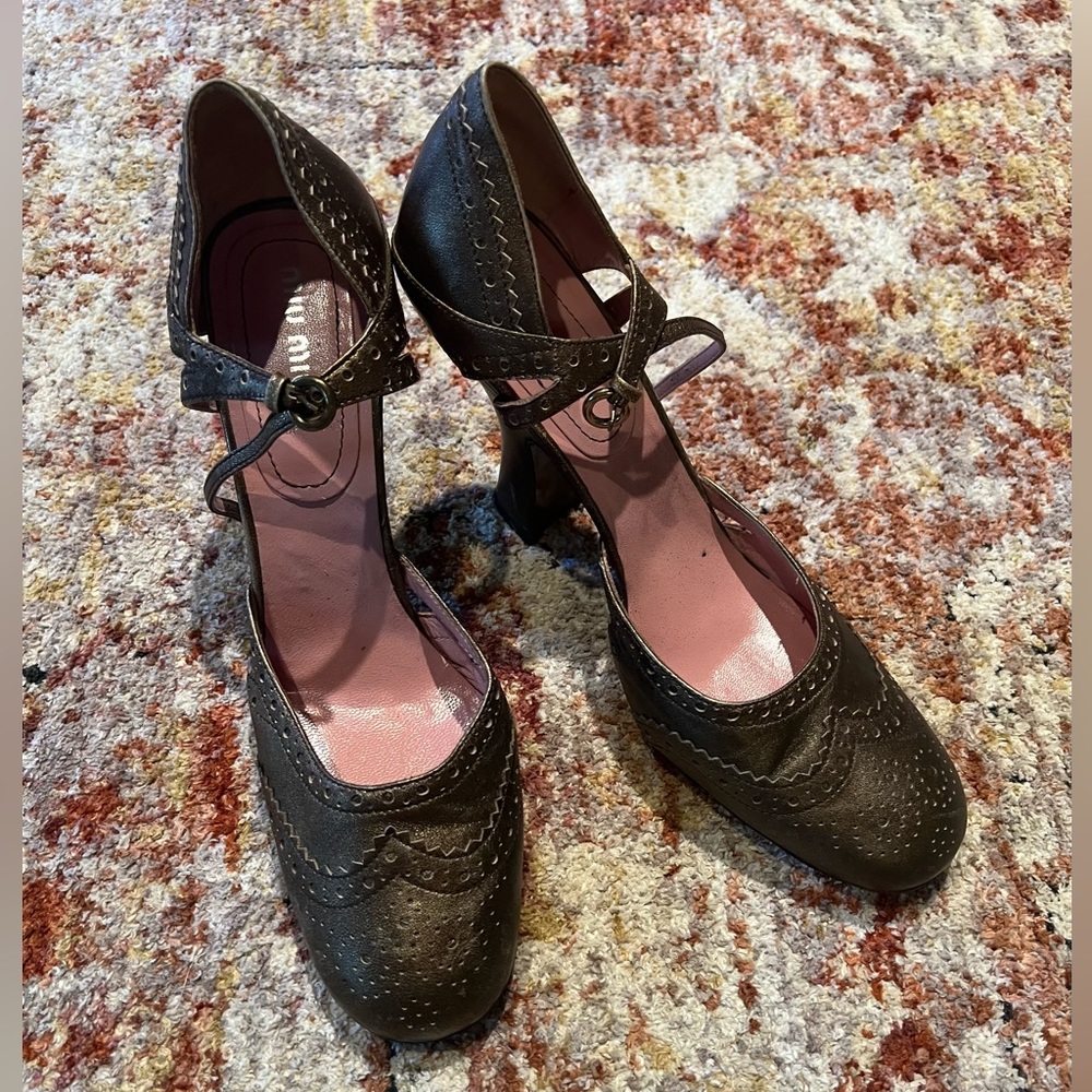 Miu Miu bronze wingtip heel
